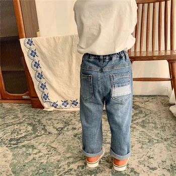 Rudenī ir 2021. unisex bērniem elastīgs ripped džinsi korejiešu stilā zēniem un meitenēm zaudēt taisnas džinsa bikses